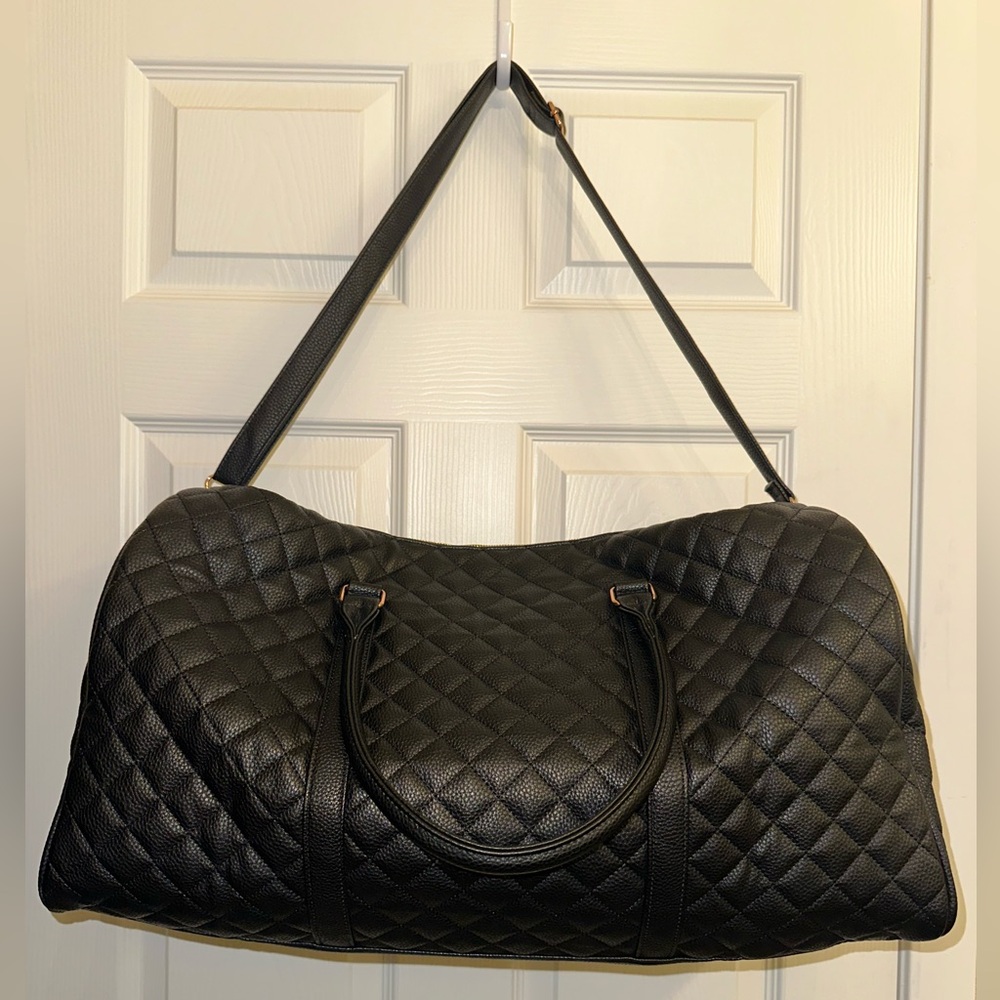 Black quilted vegan leather duffle bag